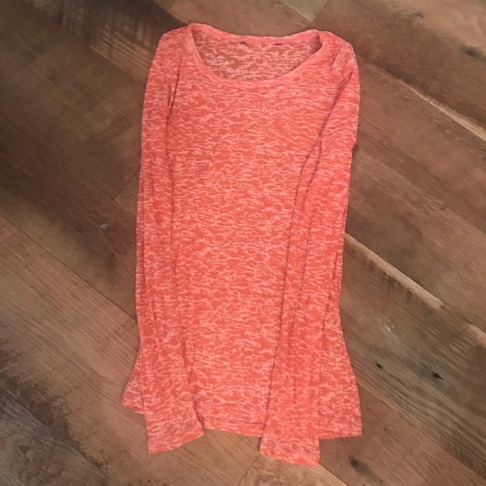 Orange and white top. Kind of sheer.